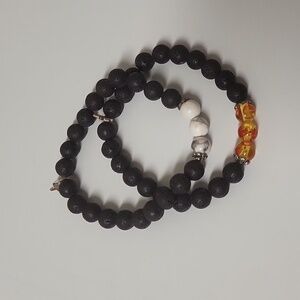 Set of two handmade Beaded Bracelets with white and golden yellow designs